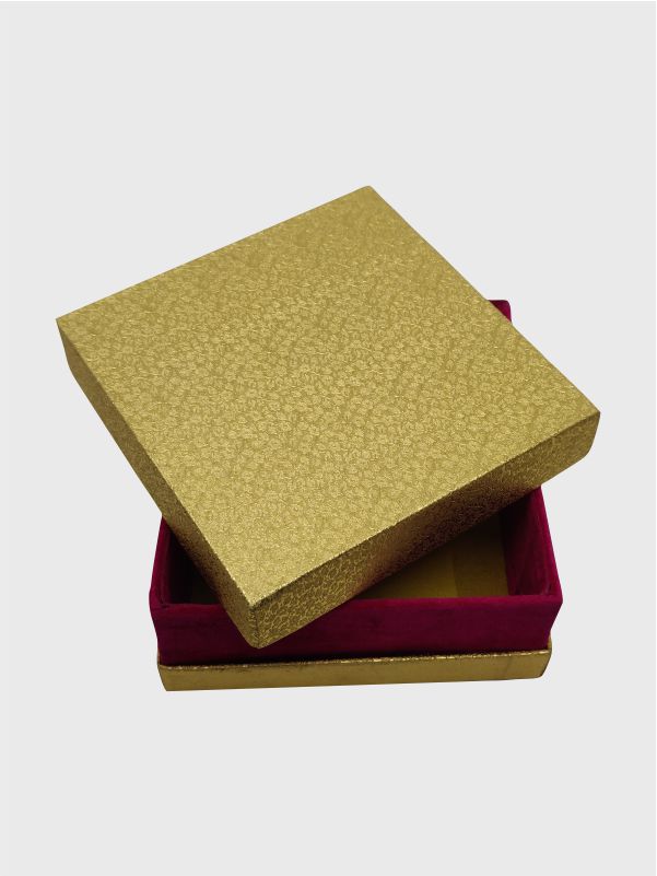 Partially opened view of a designer shoulder neck rigid box, showcasing the visible dark pink neck and luxurious gold Rexene finish.